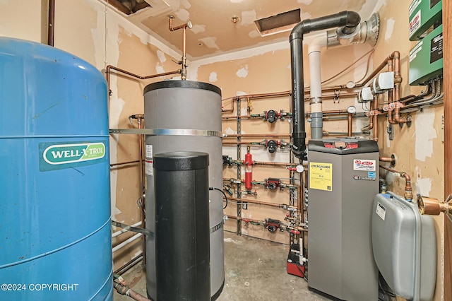 37905 Hall Rd, Sterling, AK 99672 - utility room with strapped water heater