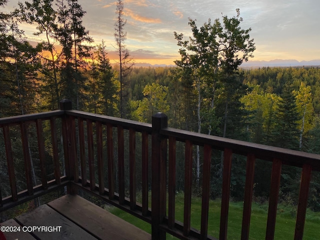 37905 Hall Rd, Sterling, AK 99672 - balcony at dusk with a wooded view