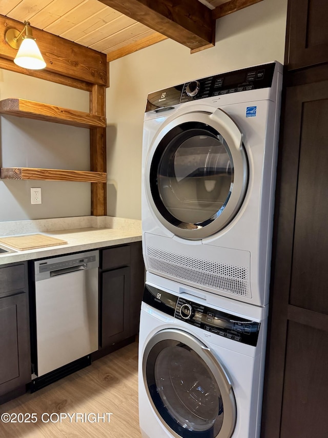 37905 Hall Rd, Sterling, AK 99672 - laundry area featuring stacked washer / drying machine, light wood finished floors, and wood ceiling
