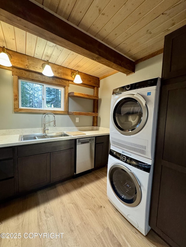 37905 Hall Rd, Sterling, AK 99672 - laundry room featuring stacked washing machine and dryer, light wood-style flooring, and wooden ceiling
