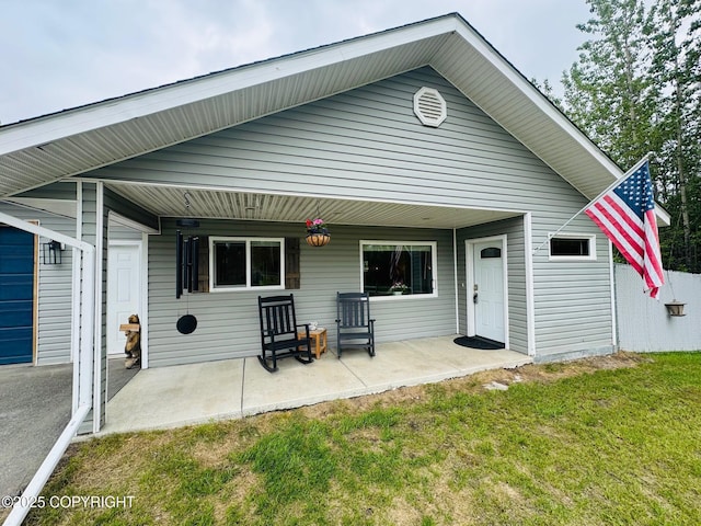 6780 W Blondell Dr, Wasilla, AK 99623 - back of property featuring a lawn and a patio area