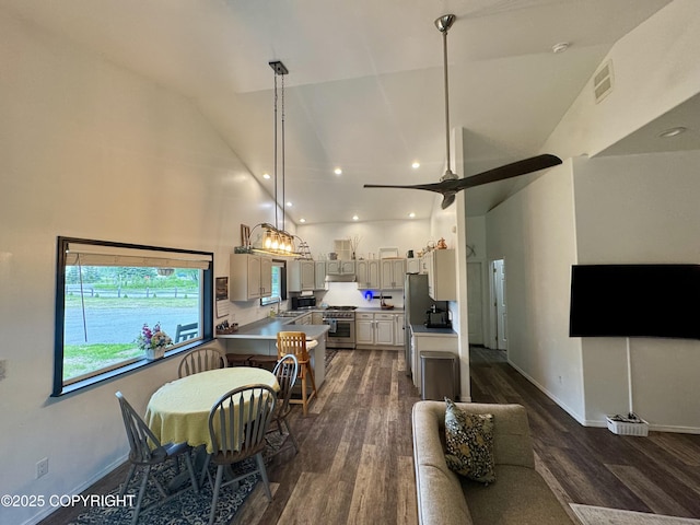 6780 W Blondell Dr, Wasilla, AK 99623 - dining room with dark wood finished floors, high vaulted ceiling, recessed lighting, and ceiling fan