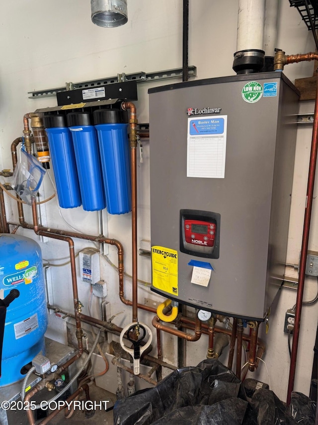 6780 W Blondell Dr, Wasilla, AK 99623 - utility room featuring water heater