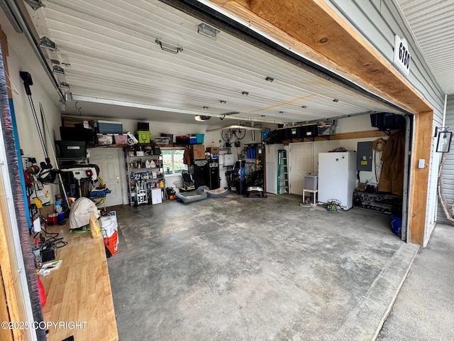 6780 W Blondell Dr, Wasilla, AK 99623 - garage featuring electric panel and a workshop area