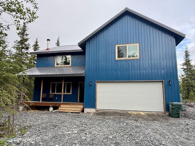 11157 S Berut Rd, Palmer, AK 99645 - view of front facade featuring covered porch, a metal roof, driveway, and an attached garage