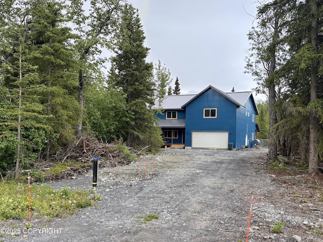 11157 S Berut Rd, Palmer, AK 99645 - view of front of home featuring a metal roof, an attached garage, and dirt driveway