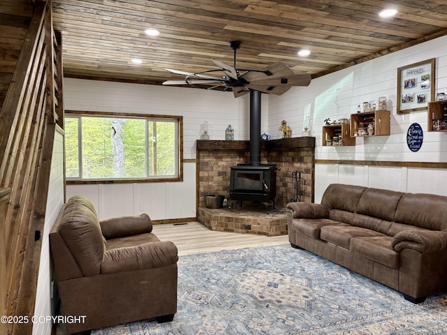 11157 S Berut Rd, Palmer, AK 99645 - living area with wooden ceiling, wood finished floors, a wood stove, ceiling fan, and recessed lighting