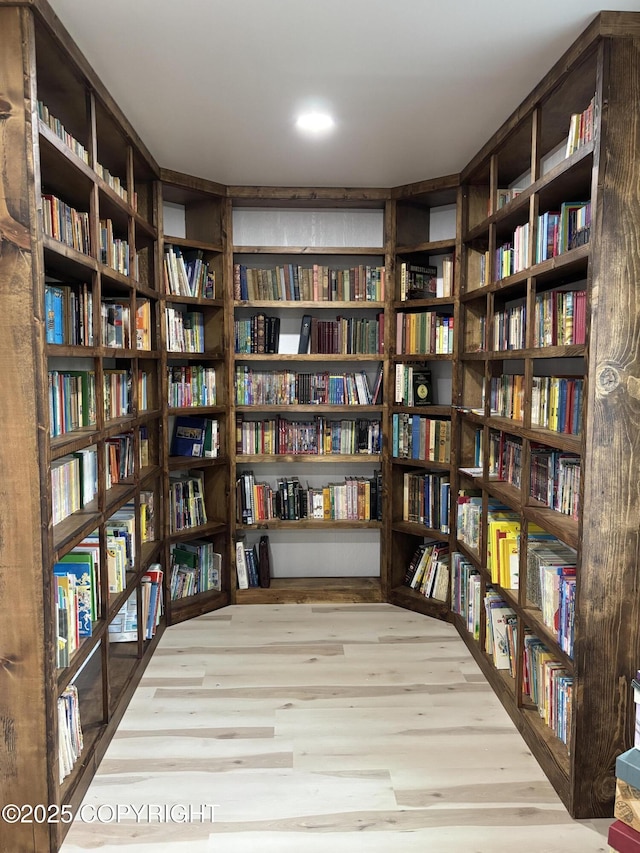 11157 S Berut Rd, Palmer, AK 99645 - sitting room with bookshelves and wood finished floors