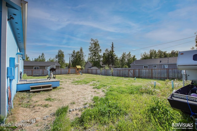 1524 N Little Susitna Dr, Wasilla, AK 99654 - fenced backyard with a playground and a deck
