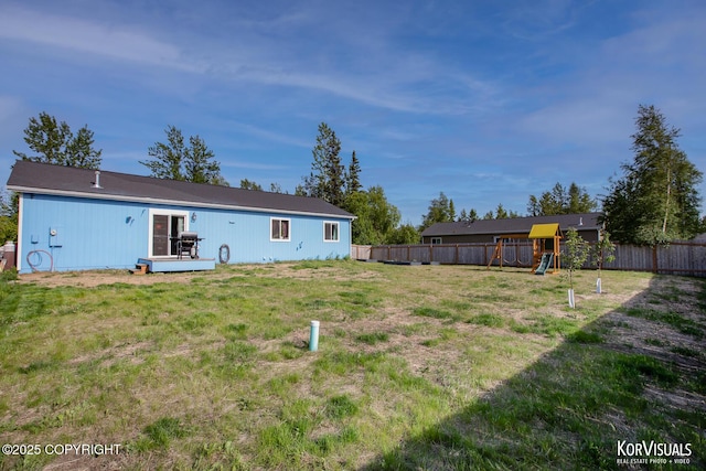 1524 N Little Susitna Dr, Wasilla, AK 99654 - rear view of house featuring a playground and a fenced backyard