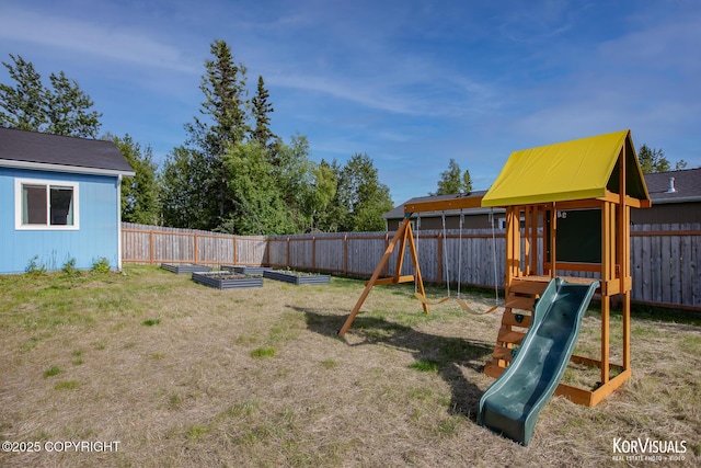 1524 N Little Susitna Dr, Wasilla, AK 99654 - view of jungle gym with a vegetable garden and a fenced backyard