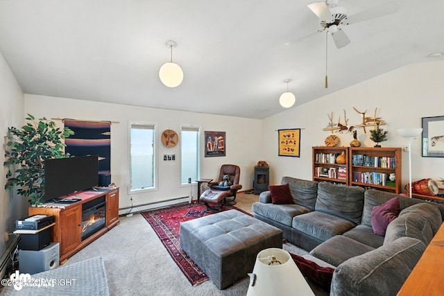 222 Crest Dr, Soldotna, AK 99669 - living area with baseboard heating, carpet, vaulted ceiling, a wood stove, and a ceiling fan