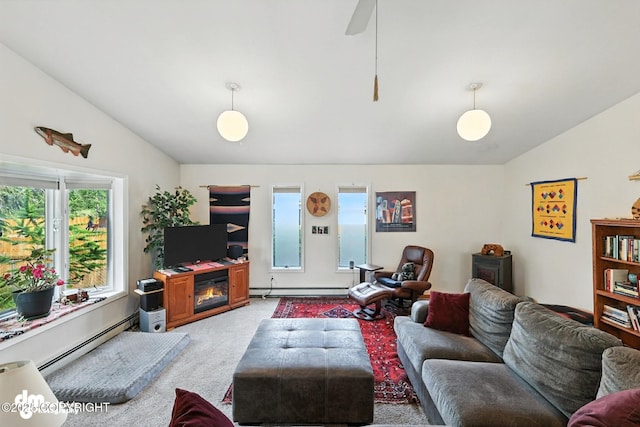 222 Crest Dr, Soldotna, AK 99669 - living area with vaulted ceiling, a baseboard radiator, light carpet, and baseboard heating