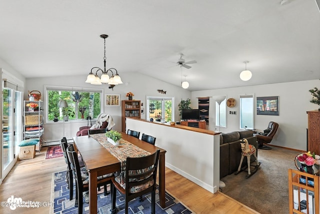 222 Crest Dr, Soldotna, AK 99669 - dining space featuring healthy amount of natural light, lofted ceiling, light wood-type flooring, a ceiling fan, and a chandelier