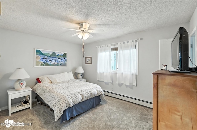 222 Crest Dr, Soldotna, AK 99669 - bedroom with baseboard heating, carpet floors, a textured ceiling, and a ceiling fan