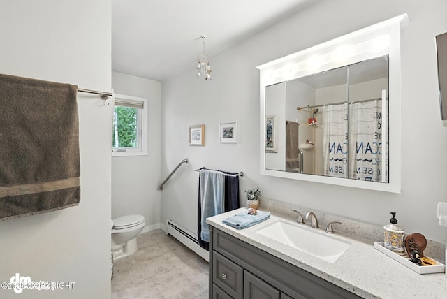 222 Crest Dr, Soldotna, AK 99669 - bathroom with vanity, baseboard heating, and a chandelier