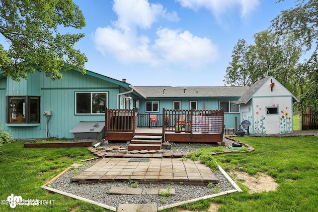 222 Crest Dr, Soldotna, AK 99669 - back of property with a deck, a yard, and a shed