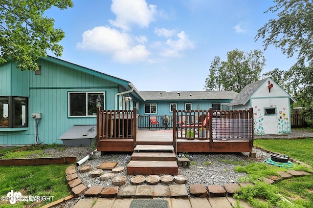 222 Crest Dr, Soldotna, AK 99669 - rear view of property featuring a storage unit and a deck