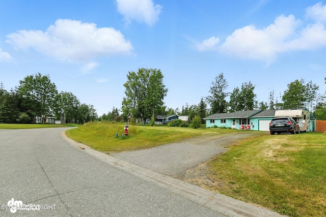 222 Crest Dr, Soldotna, AK 99669 - ranch-style home with a garage, driveway, and a front lawn