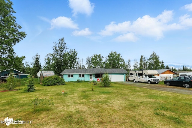 222 Crest Dr, Soldotna, AK 99669 - ranch-style house featuring an attached garage, asphalt driveway, and a front yard