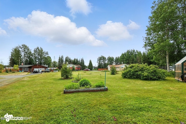 222 Crest Dr, Soldotna, AK 99669 - view of green lawn featuring driveway