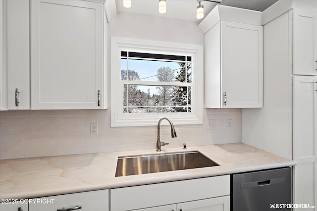 3031 Bennett Ave, Anchorage, AK 99517 - kitchen with dishwasher, decorative backsplash, white cabinets, and light stone countertops