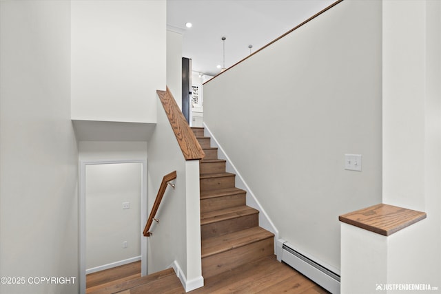 3031 Bennett Ave, Anchorage, AK 99517 - staircase with a baseboard radiator, wood finished floors, and recessed lighting