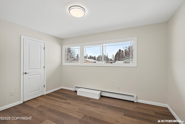 3031 Bennett Ave, Anchorage, AK 99517 - spare room with baseboard heating and wood finished floors