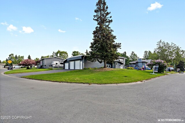 3031 Bennett Ave, Anchorage, AK 99517 - view of front of property featuring a front lawn, a residential view, and driveway