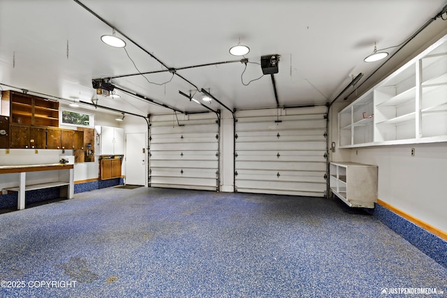 3031 Bennett Ave, Anchorage, AK 99517 - garage with a garage door opener and baseboards