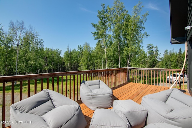38835 Pinewood Ave, Sterling, AK 99672 - wooden deck featuring an outdoor hangout area and view of scattered trees