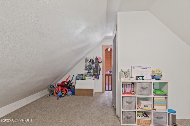 38835 Pinewood Ave, Sterling, AK 99672 - game room featuring lofted ceiling, a textured ceiling, and carpet