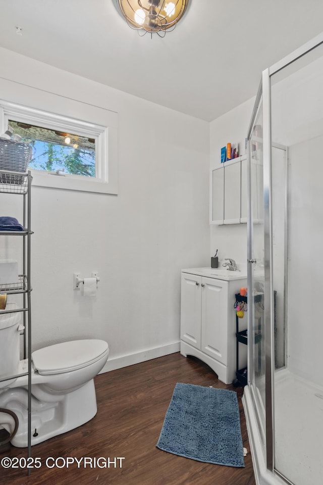 38835 Pinewood Ave, Sterling, AK 99672 - bathroom with a stall shower, wood finished floors, and vanity