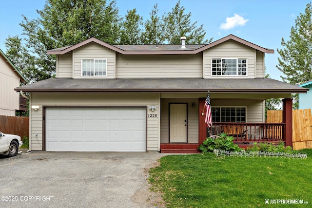 1220 S Felton St, Palmer, AK 99645 - view of front of home with an attached garage, covered porch, driveway, and roof with shingles