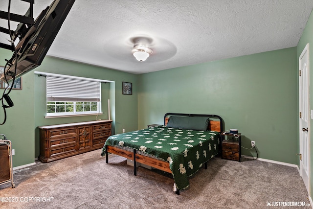 1220 S Felton St, Palmer, AK 99645 - carpeted bedroom with a textured ceiling and baseboards