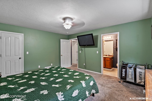 1220 S Felton St, Palmer, AK 99645 - carpeted bedroom featuring ensuite bath, ceiling fan, and a textured ceiling