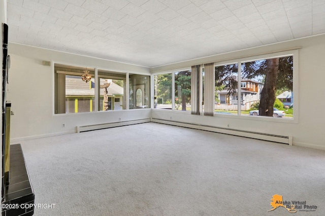 1110 F St, Anchorage, AK 99501 - empty room featuring carpet and a baseboard radiator