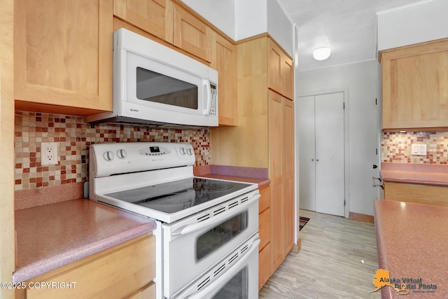 1110 F St, Anchorage, AK 99501 - kitchen with white appliances, light brown cabinets, and decorative backsplash