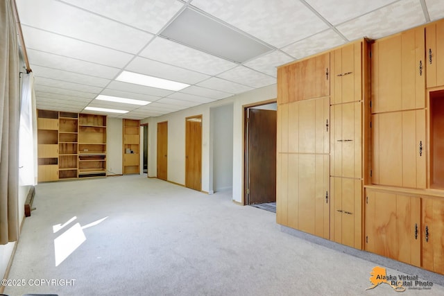 1110 F St, Anchorage, AK 99501 - basement with a paneled ceiling and light carpet