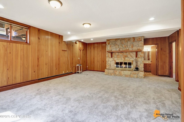 1110 F St, Anchorage, AK 99501 - unfurnished living room featuring wooden walls, a fireplace, carpet, and recessed lighting