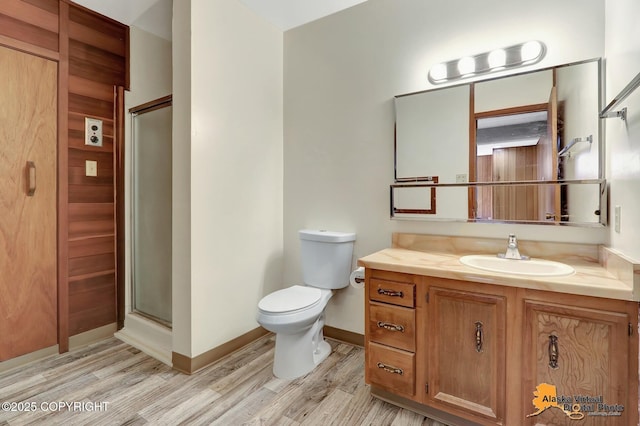 1110 F St, Anchorage, AK 99501 - full bathroom featuring wood finished floors, vanity, and a shower stall