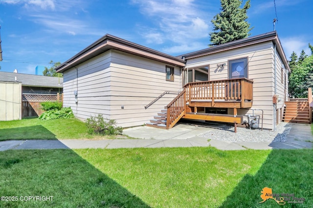 1110 F St, Anchorage, AK 99501 - rear view of house with stairs and a wooden deck