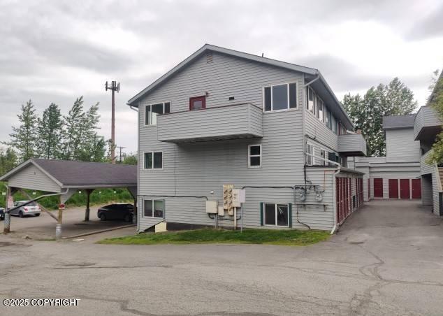 7141 Weimer Rd # 46, Anchorage, AK 99502 - back of property with covered parking