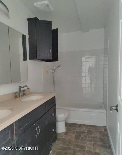 7141 Weimer Rd # 46, Anchorage, AK 99502 - full bathroom featuring double vanity, bathing tub / shower combination, and stone finish flooring