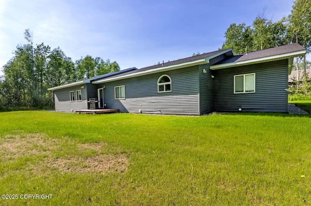 4853 N Riverstone Cir, Palmer, AK 99645 - rear view of property with a yard