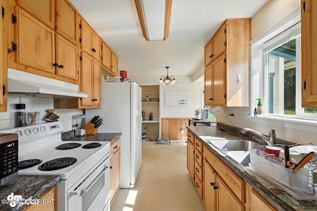 600 E Strathclyde Ln, Wasilla, AK 99654 - kitchen with electric stove, under cabinet range hood, light floors, and plenty of natural light