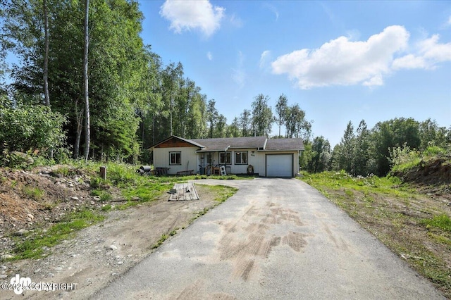 600 E Strathclyde Ln, Wasilla, AK 99654 - view of front of house with driveway and a garage