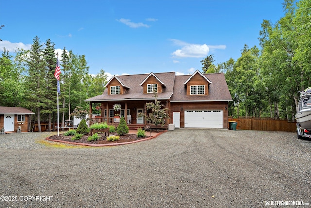 4051 Twilight Ln, Anchorage, AK 99516 - view of front of house featuring covered porch, gravel driveway, a garage, a shed, and a shingled roof