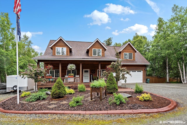 4051 Twilight Ln, Anchorage, AK 99516 - view of front facade with a porch, driveway, a shingled roof, and a garage