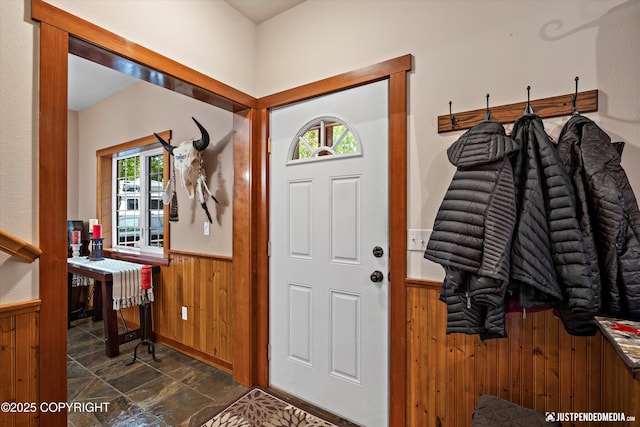 4051 Twilight Ln, Anchorage, AK 99516 - entrance foyer featuring wainscoting, wooden walls, and dark stone finish floors